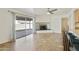 Bright living space featuring tile floors, a fireplace, and sliding glass doors to the backyard at 15218 N 37Th Ave, Phoenix, AZ 85053