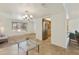 Spacious interior view showing the seamless transition between living room, breakfast bar, dining area, and kitchen at 15218 N 37Th Ave, Phoenix, AZ 85053