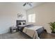 Cozy bedroom with a tufted headboard, soft carpet, and bright window at 154 W 5Th St # 157, Tempe, AZ 85281