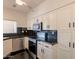 Bright kitchen featuring modern appliances, white cabinets, and dark countertops at 154 W 5Th St # 157, Tempe, AZ 85281