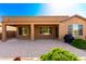 View of covered patio with backyard and desert landscaping at 16390 W Sheila Ln, Goodyear, AZ 85395