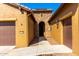 Unique home showcasing desert landscaping, architectural details, and a welcoming entryway at 16390 W Sheila Ln, Goodyear, AZ 85395