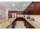 Spacious kitchen featuring granite countertops, stainless steel appliances, and ample cabinet space at 16390 W Sheila Ln, Goodyear, AZ 85395