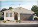 Inviting single-story home with a two-car garage, neutral stucco finish, and desert landscaping at 17630 W Adams St, Goodyear, AZ 85338