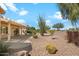 Desert landscaped backyard, perfect for relaxing and entertaining at 17661 N Saddle Ridge Dr, Surprise, AZ 85374