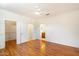 Bedroom featuring hardwood floors, ceiling fan, and closet at 17661 N Saddle Ridge Dr, Surprise, AZ 85374