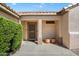 Inviting front porch with desert landscaping and a secure screen door entrance at 17661 N Saddle Ridge Dr, Surprise, AZ 85374