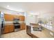 Well-designed kitchen featuring stainless steel appliances and an island bar at 17661 N Saddle Ridge Dr, Surprise, AZ 85374