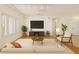 Cozy living room with a ceiling fan, neutral color palette, and abundant natural light at 17661 N Saddle Ridge Dr, Surprise, AZ 85374