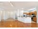 Bright open living area with hardwood floors seamlessly flowing into the kitchen at 17661 N Saddle Ridge Dr, Surprise, AZ 85374