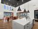 Clubhouse kitchen island and dining area create an open, airy space for community socializing and meal preparation at 17708 W Amber Dr, Goodyear, AZ 85338