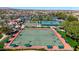 Aerial view of community lawn bowling court, lush landscaping, and a mountain view at 18102 N Petrified Forest Dr, Surprise, AZ 85374