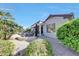 Beautiful desert landscaping surrounds the outdoor patio of this well maintained home at 18102 N Petrified Forest Dr, Surprise, AZ 85374