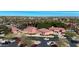 Aerial view of a community clubhouse with palm trees, desert landscaping, and a parking lot at 18102 N Petrified Forest Dr, Surprise, AZ 85374