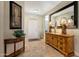 This entryway features decoratively tiled floors, and elegant furnishings at 18102 N Petrified Forest Dr, Surprise, AZ 85374