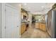 Bright, airy kitchen with stainless steel appliances, light wood cabinets, and granite countertops at 18102 N Petrified Forest Dr, Surprise, AZ 85374