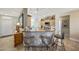 Kitchen featuring a granite breakfast bar with seating and track lighting at 18102 N Petrified Forest Dr, Surprise, AZ 85374