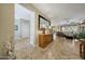 Open-concept living room with tile flooring, ceiling fan, and a view of the neighborhood at 18102 N Petrified Forest Dr, Surprise, AZ 85374