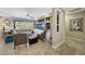 Spacious living room with built-in shelving, a ceiling fan, and large windows at 18102 N Petrified Forest Dr, Surprise, AZ 85374