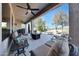 Spacious covered patio with fan and comfortable seating at 18102 N Petrified Forest Dr, Surprise, AZ 85374