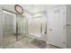 Bathroom showing walk-in shower with glass enclosure and mirrored closet doors at 18102 N Petrified Forest Dr, Surprise, AZ 85374