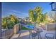 Relaxing balcony with seating area overlooking the sparkling pool and landscaped backyard at 188 E Mountain View Rd, San Tan Valley, AZ 85143