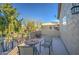 Balcony view featuring chairs, tables, and wrought iron overlooking the pool and backyard at 188 E Mountain View Rd, San Tan Valley, AZ 85143