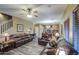 Large living room with wood flooring, fireplace, and view into the kitchen at 188 E Mountain View Rd, San Tan Valley, AZ 85143