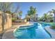 Gorgeous backyard pool with ample seating areas and lush landscaping at 188 E Mountain View Rd, San Tan Valley, AZ 85143