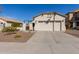 Charming single-story home featuring a two-car garage, desert landscaping, and neutral stucco exterior at 20551 N 262Nd Ave, Buckeye, AZ 85396