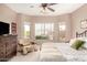 This primary bedroom is a serene retreat with neutral walls, bay windows, and a sitting area at 20551 N 262Nd Ave, Buckeye, AZ 85396