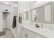 Bright bathroom featuring a modern vanity, neutral paint, framed mirror and tile flooring at 21921 E Domingo Rd, Queen Creek, AZ 85142