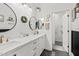 Elegant bathroom featuring double sinks, granite countertops, and stylish fixtures at 21921 E Domingo Rd, Queen Creek, AZ 85142