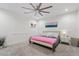 Bright and airy bedroom featuring a soft pink blanket, stylish decor and a ceiling fan at 21921 E Domingo Rd, Queen Creek, AZ 85142