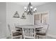 Charming dining room featuring a modern chandelier and stylish ship lap accent wall at 21921 E Domingo Rd, Queen Creek, AZ 85142