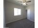 Bedroom with plush carpet, closet and a window offering natural light at 26409 W Desert Crest St, Casa Grande, AZ 85193