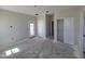 View of a bedroom with sliding closet doors, freshly painted walls, and access to the outside at 26409 W Desert Crest St, Casa Grande, AZ 85193