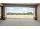 Back patio view with golf course view on a sunny day at 26664 W Siesta Ln, Buckeye, AZ 85396