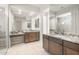 Bright bathroom featuring granite countertops, double sinks, and a walk-in shower at 26664 W Siesta Ln, Buckeye, AZ 85396