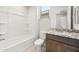 Bright bathroom features a granite vanity, and a shower-tub combo at 26664 W Siesta Ln, Buckeye, AZ 85396