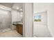 Modern bathroom featuring a walk-in shower, granite countertops, and neutral color palette with an open doorway at 26664 W Siesta Ln, Buckeye, AZ 85396