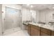 Modern bathroom featuring a glass-enclosed shower, granite countertops, and ample vanity space at 26664 W Siesta Ln, Buckeye, AZ 85396