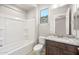 Well-lit bathroom with a granite vanity, toilet, and tub with shower; perfect for relaxation at 26664 W Siesta Ln, Buckeye, AZ 85396