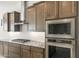Kitchen features stainless appliances including a built-in microwave and oven combo at 26664 W Siesta Ln, Buckeye, AZ 85396