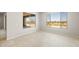 Bright, open-concept space with large windows overlooking a green view at 26664 W Siesta Ln, Buckeye, AZ 85396