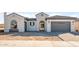 Charming stucco home features a gray tile roof and an attached two-car garage at 26903 W Renee Dr, Buckeye, AZ 85396