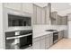 A detailed view of the kitchen's built-in microwave and oven, gas cooktop, and ample cabinet space at 26903 W Renee Dr, Buckeye, AZ 85396