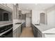 Open kitchen layout with stainless steel appliances, plenty of counter space, and modern fixtures at 26903 W Renee Dr, Buckeye, AZ 85396