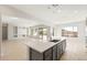 Kitchen island with sink overlooking the living area and stunning mountain views at 26903 W Renee Dr, Buckeye, AZ 85396