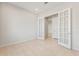 Bright home office with tiled floors and glass paneled French doors at 26903 W Renee Dr, Buckeye, AZ 85396